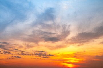 Obraz premium Beautiful , luxury soft gradient orange gold clouds and sunlight on the blue sky perfect for the background, take in evening,Twilight, Large size, high definition landscape photo