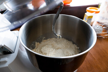 making a cake in a mixer. Cake with white topping. Dessert