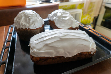 making a cake in a mixer. Cake with white topping. Dessert