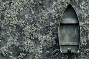 Boat against textured wall with moss and weathered surface