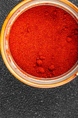 Ground hot red pepper cayenne pepper paprika spice appetizer vegetables dish organic product fresh tasty gourmet food background on the table rustic food top view copy space
