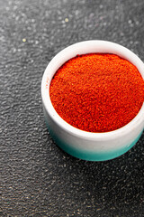 Ground hot red pepper cayenne pepper paprika spice appetizer vegetables dish organic product fresh tasty gourmet food background on the table rustic food top view copy space