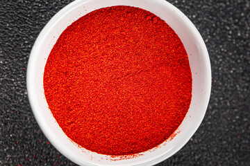 Ground hot red pepper cayenne pepper paprika spice appetizer vegetables dish organic product fresh...