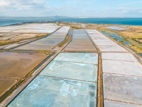 Aerial view of salt evaporation ponds of various shapes