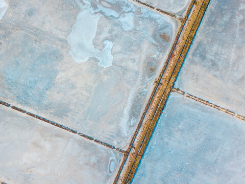 Aerial view of salt evaporation ponds of various shapes