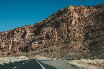 Empty road through mountainous terrain