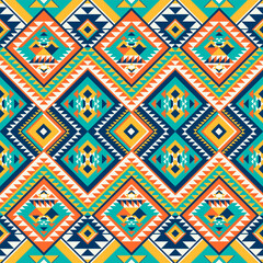 Vibrant tribal pattern with geometric diamond motifs in teal orange yellow and navy. Bold Aztec inspired design perfect for fashion textiles and home decor products.
