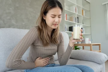 Gordijnen Milk allergens, Sick sad unhealthy ill allergic woman, runny stuffy sore nose suffer from intolerance allergy trigger symptoms. abdominal pain, allergens, nut protein, rash, death, food allergy © Shisu_ka