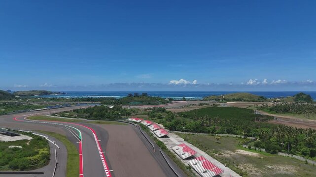 The Mandalika Circuit in Lombok is a modern MotoGP race track located along a stunning tropical coastline in Indonesia.