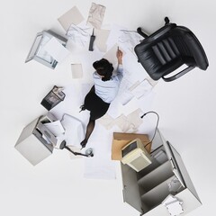 Office worker on floor buried in paperwork, surrounded by chair, vintage cabinet, scanner and paper...