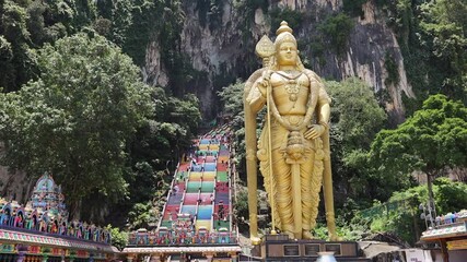 Batu Caves in Kuala Lumpur city. Giant Murugan statue at the entrance of Batu Caves, Malaysia