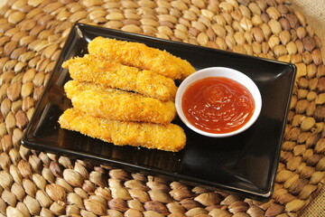A plate of nugget snacks. Fried nuggets with sauce