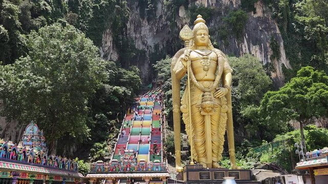 Batu Caves in Kuala Lumpur city. Giant Murugan statue at the entrance of Batu Caves, Malaysia