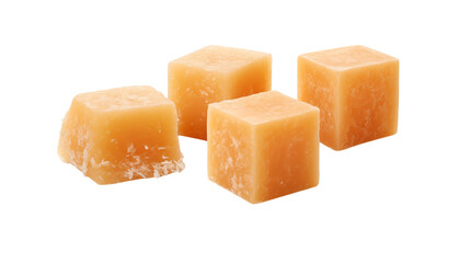 Close up of four cheddar cheese cubes on a black background