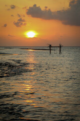 Beautiful sunset at Fulidhoo beach island in Maldives