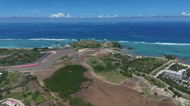 The Mandalika Circuit in Lombok is a modern MotoGP race track located along a stunning tropical coastline in Indonesia.