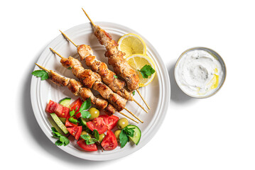 Grilled chicken kebabs with fresh vegetable salad and tzatziki sauce