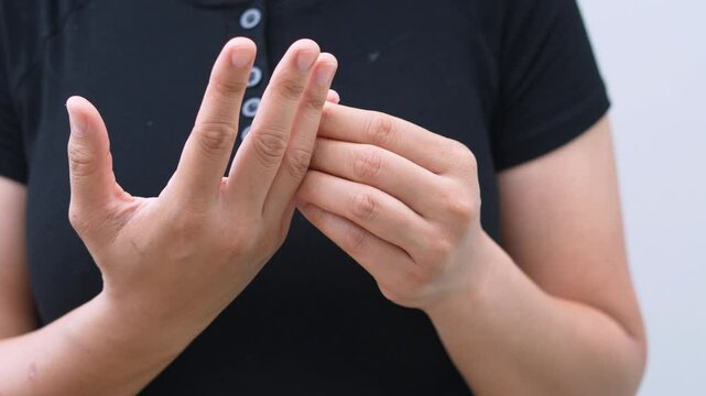 A woman has pain in her fingers and arthritis.