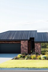 Fototapeta premium This contemporary, single-story brick residence boasts a sleek architectural design and features a beautifully landscaped yard, all set in a picturesque suburban environment basking in bright daylight