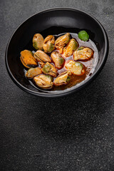 Mussels seafood canned appetizer dish organic fresh tasty gourmet food background on the table rustic food top view copy space