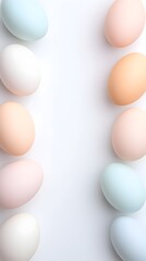 Pastel eggs border on white background, space for text