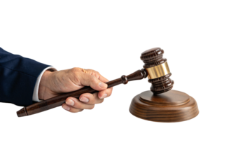Hand wearing navy suit prepares to strike gavel on wooden base, indicating a courtroom decision, isolated on a transparent background