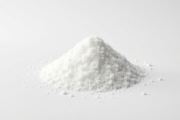 Pile of white granulated sugar on white background, refined, macro