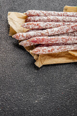 Sausage dried salami aperitif meat natural food dish organic product fresh tasty gourmet food background on the table rustic food top view copy space
