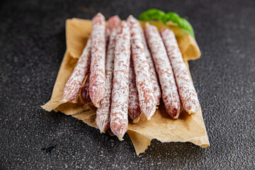 Sausage dried salami aperitif meat natural food dish organic product fresh tasty gourmet food background on the table rustic food top view copy space