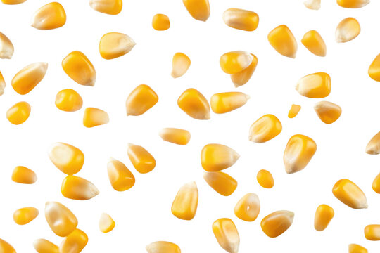 Yellow corn kernels scattered, showcasing their smooth texture and varying shapes.