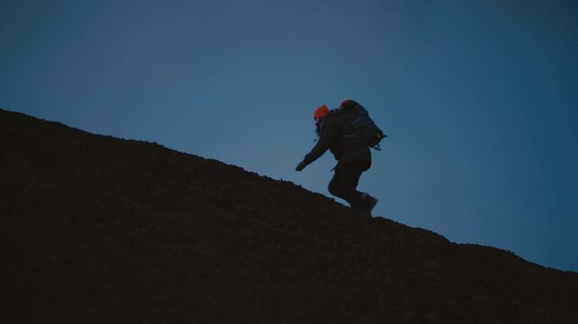 Man Exploring and Photographing Iceland&rsquo;s Black Sand Beach