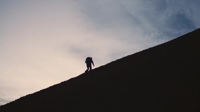 Man Exploring and Photographing Iceland&rsquo;s Black Sand Beach