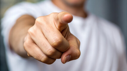close up of hand pointing, conveying sense of direction and emphasis. gesture suggests communication and engagement