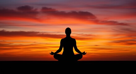Silhouette of meditating person at sunset (Photo)
