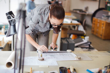 Young woman working in a startup company office