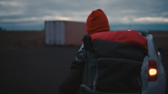 Man Walking to Car Early Morning in Iceland