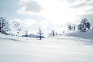 Obraz premium A serene and tranquil winter landscape of rolling hills covered in pristine white snow with bare trees against a bright, sunlit sky