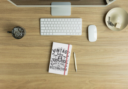 Notebook Mockup on a Sleek Wooden Desk Setup