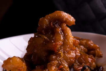 Sweet and sour chicken. Fried meat. Food concept. Chopsticks