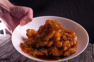 Sweet and sour chicken. Fried meat. Food concept. Chopsticks