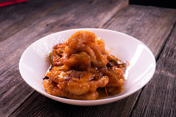 Sweet and sour chicken. Fried meat. Food concept. Chopsticks
