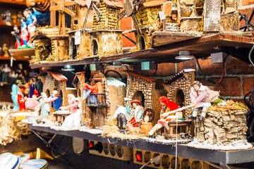 Christmas nativity scenes representing everyday life displayed on shelves