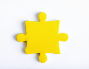 Obraz premium Yellow puzzle piece isolated on white background. Minimalist design.