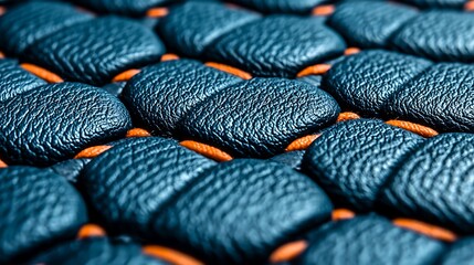 Textured Navy Cushions with Orange Woven Detail - Close-Up Abstract Pattern for Modern Design Applications and Surface Finishes.