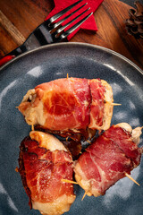 Chicken breast  wrapped with bacon.