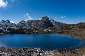 Naklejka premium Beautiful Glacial Lake in the Himalayas of Suryakunda, Langtang National Park, Gosaikunda, Nepal with Lauribina Pass View
