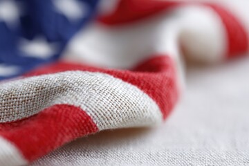 singular close-up of fabric of usa flag capturing intricate weave of red white and blue colors with minimalistic composition
