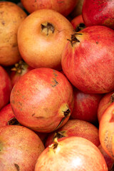 A bunch of red and orange pomegranates