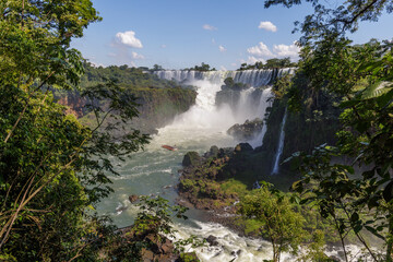 View of the Iguazu Falls among the vegetation in Iguazu National Park in Misiones, Argentina.