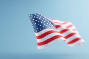 Obraz premium close-up of usa flag waving gently over clear blue sky